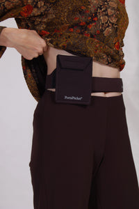 lifting a top to show hidden passport holder at waist / hip. Simple, convenient & versatile waist pocket belt 